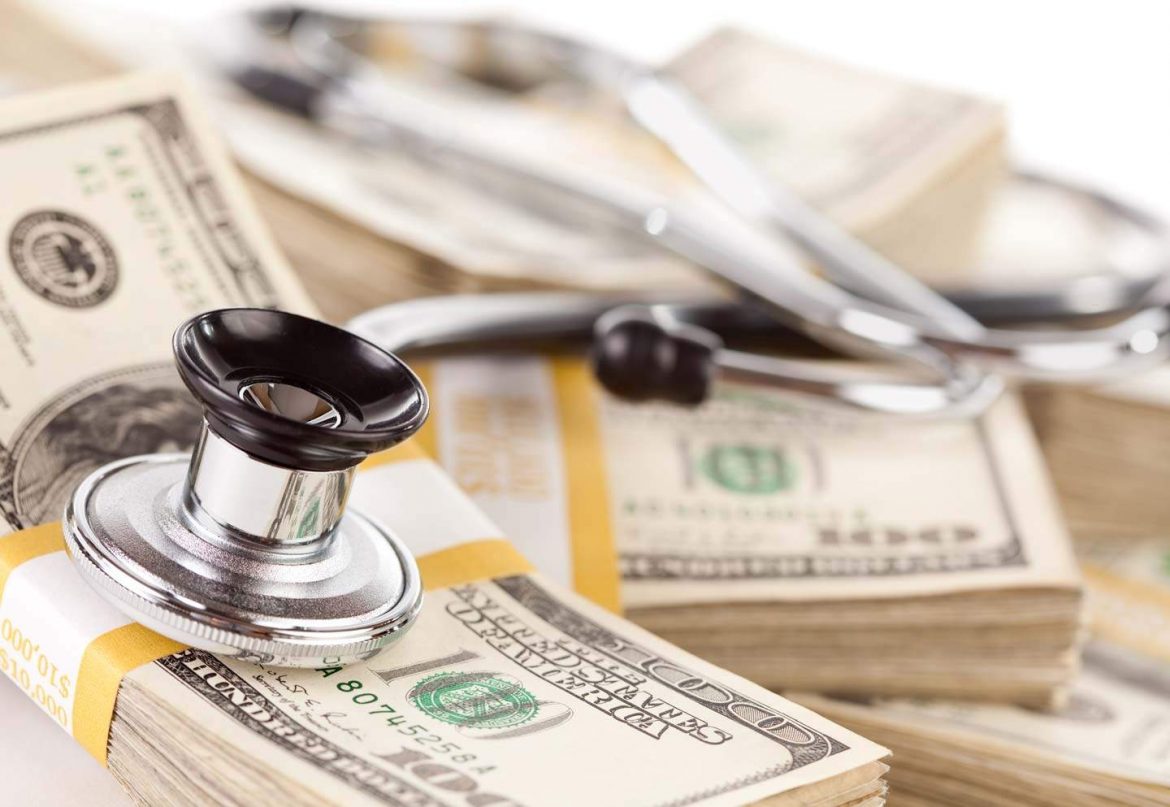 healthcare photo of stethoscope and us cash