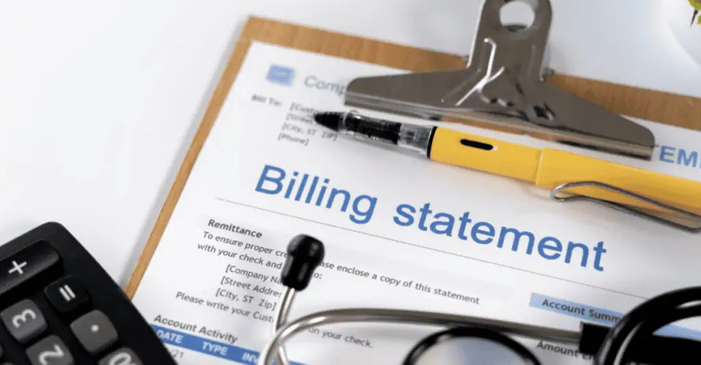 A close-up of a billing statement on a clipboard, with a pen, stethoscope, and calculator placed nearby, suggesting a medical or healthcare billing context.